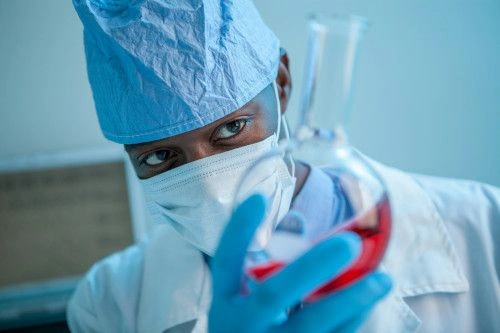 medical assistant using test tube for research